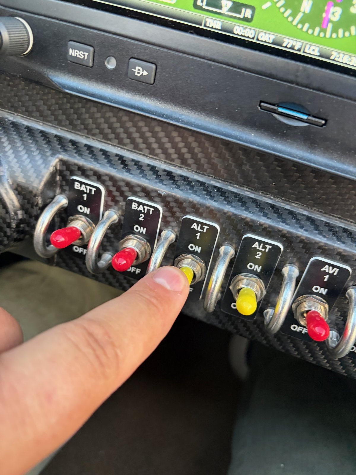 RV-10 N997CZ Flight 4 – Pointing to the ALT 1 switch on lower console, slipping alternator belt